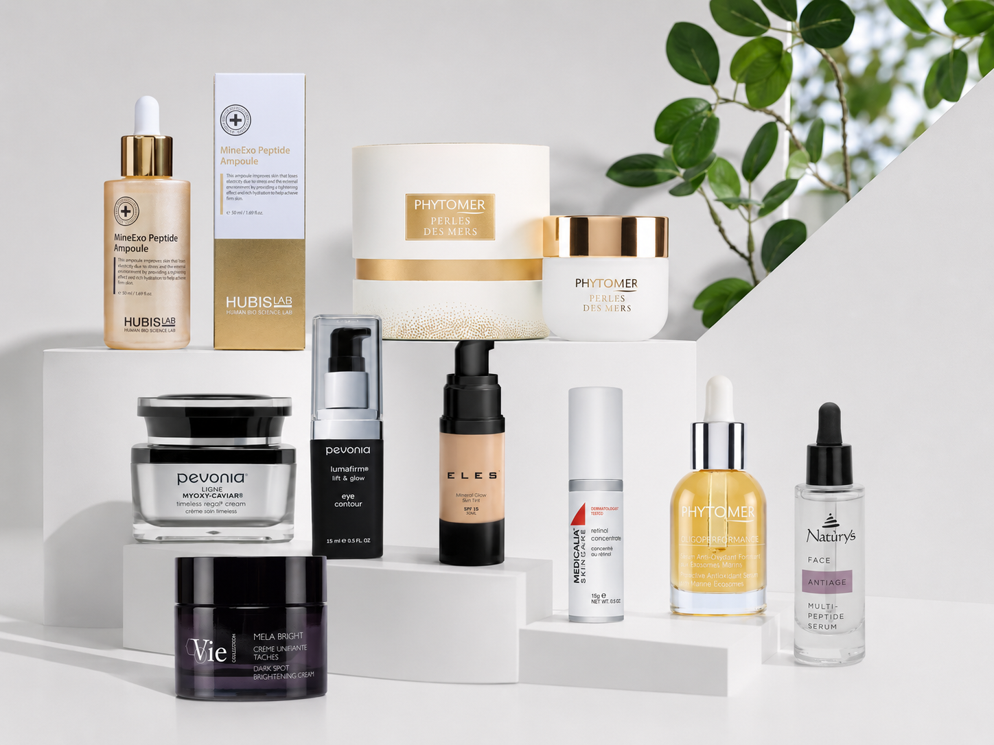 Seven premium professional skincare brands from Beauty Collective Pro — Pevonia, Phytomer, Medicalia, Hubislab, Vie Collection, Naturys and ELES — arranged on a stone surface