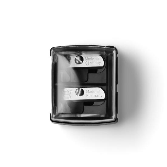A clear plastic dual deluxe sharpener with metal blades, viewed from the top.