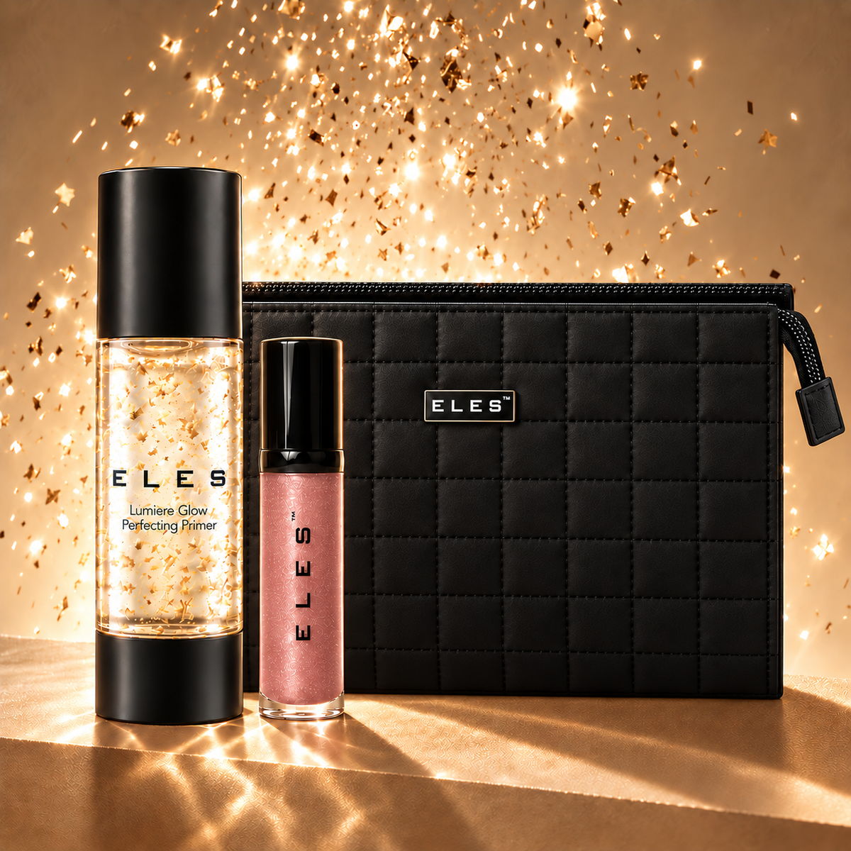 ELES Christmas pack with Lumiere Glow Perfecting Primer, Demure Colour Balm and black quilted cosmetics bag against a festive gold background