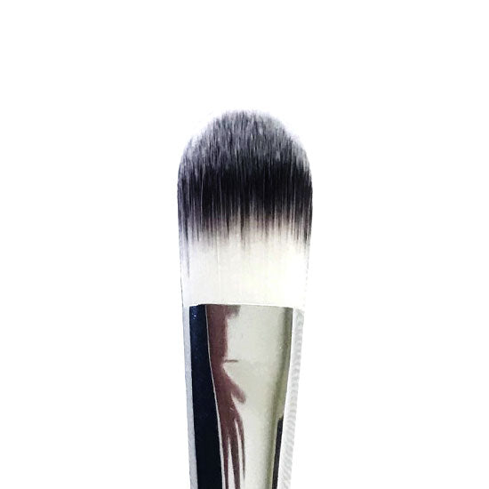 Close-up of a flat makeup brush with synthetic bristles, primarily white in color with a reflection on the brush handle.