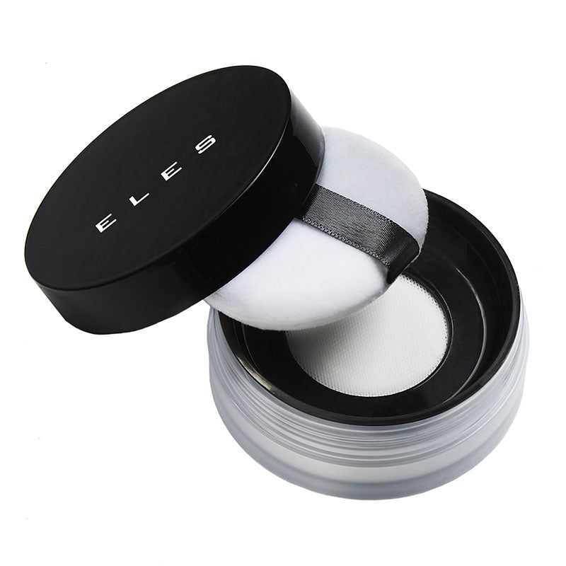 A jar of ELES HD Translucent Powder with a black lid, containing a white, spongy applicator. The product is designed for face makeup and is vegan, gluten free, paraben free, sulphate free, and talc free.