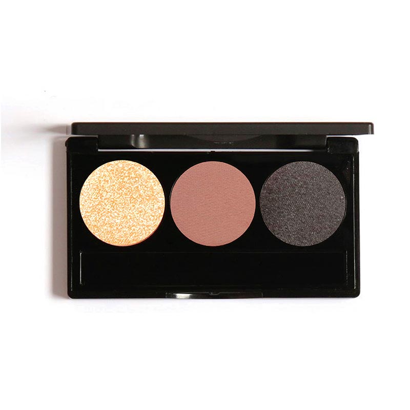 A compact eyeshadow palette with three shades: gold, brown, and black, arranged in a row.