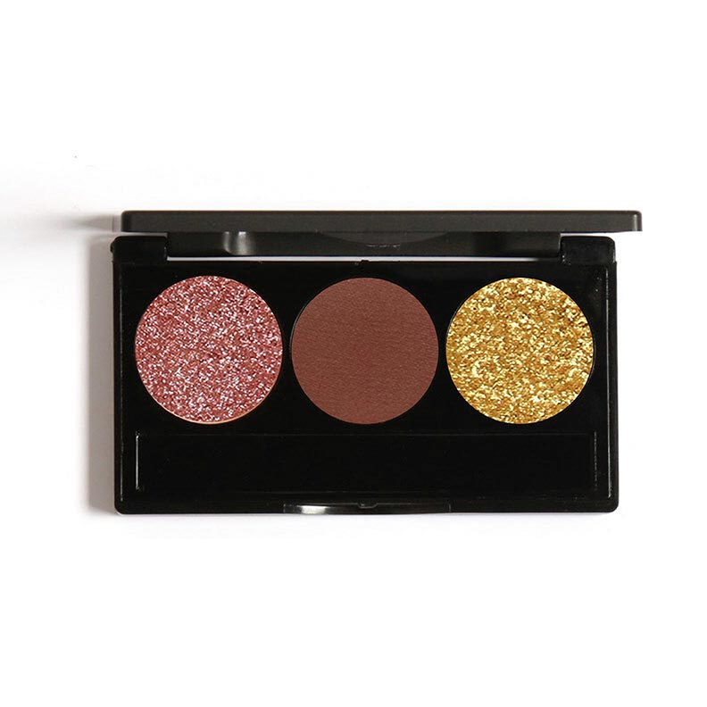 A compact eyeshadow palette with three shades: one pink shimmer, one brown matte, and one gold glitter.