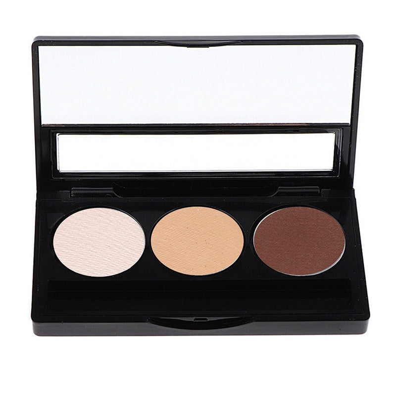 A eyeshadow palette with three shades ranging from nude to brown, presented in a black case with a mirror.