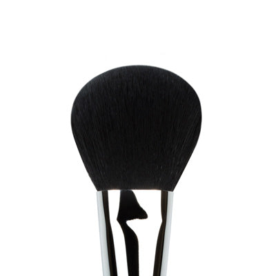 A close-up image of a powder brush with a fluffy black bristle head and a metallic silver handle.