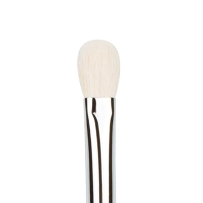 A tapered blending brush with a flat, oval-shaped head and a silver metal handle.