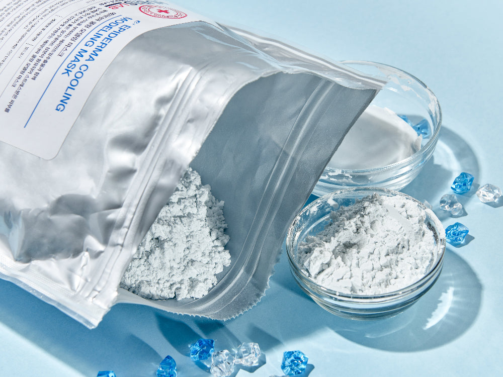 Eplus Epiderma Cooling Modeling Mask 1kg powder texture shown with silver pouch, glass bowl and cooling blue accents.