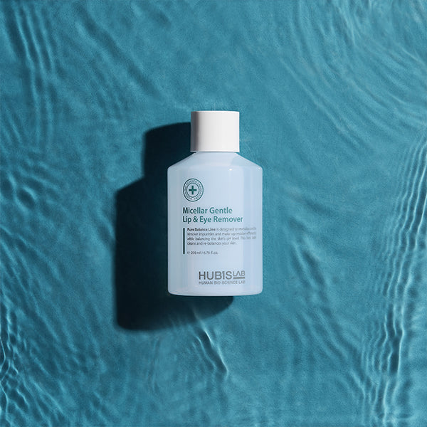Bottle of HUBIS LAB Micellar Gentle Lip & Eye Remover on a textured blue background