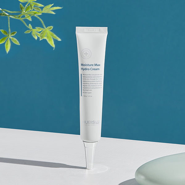 Tube of Moisture Max Hydro Cream on a white surface with a blue background
