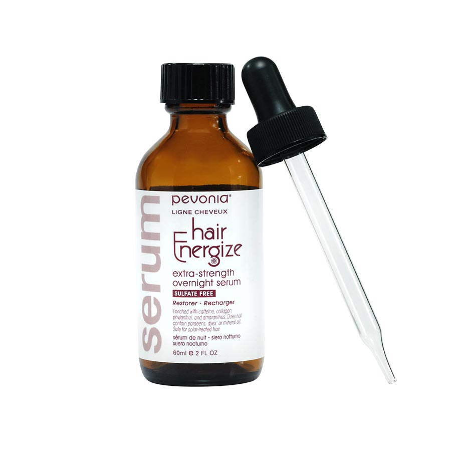 A bottle of Pevonia Hair Energize extra-strength overnight serum with a dropper, designed for hair care.