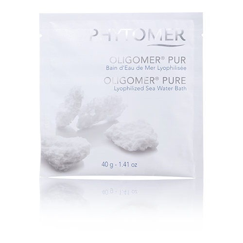 Packaging of Phytomer Oligomer Pure Concentrated Bath in Marine Trace Elements, showing a white box with the product name and image of a person relaxing in a bathtub.
