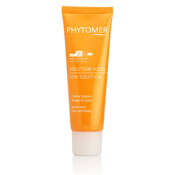 A tube of Phytomer Solution Solar Sunscreen SPF 30 Face & Body in an orange color packaging.