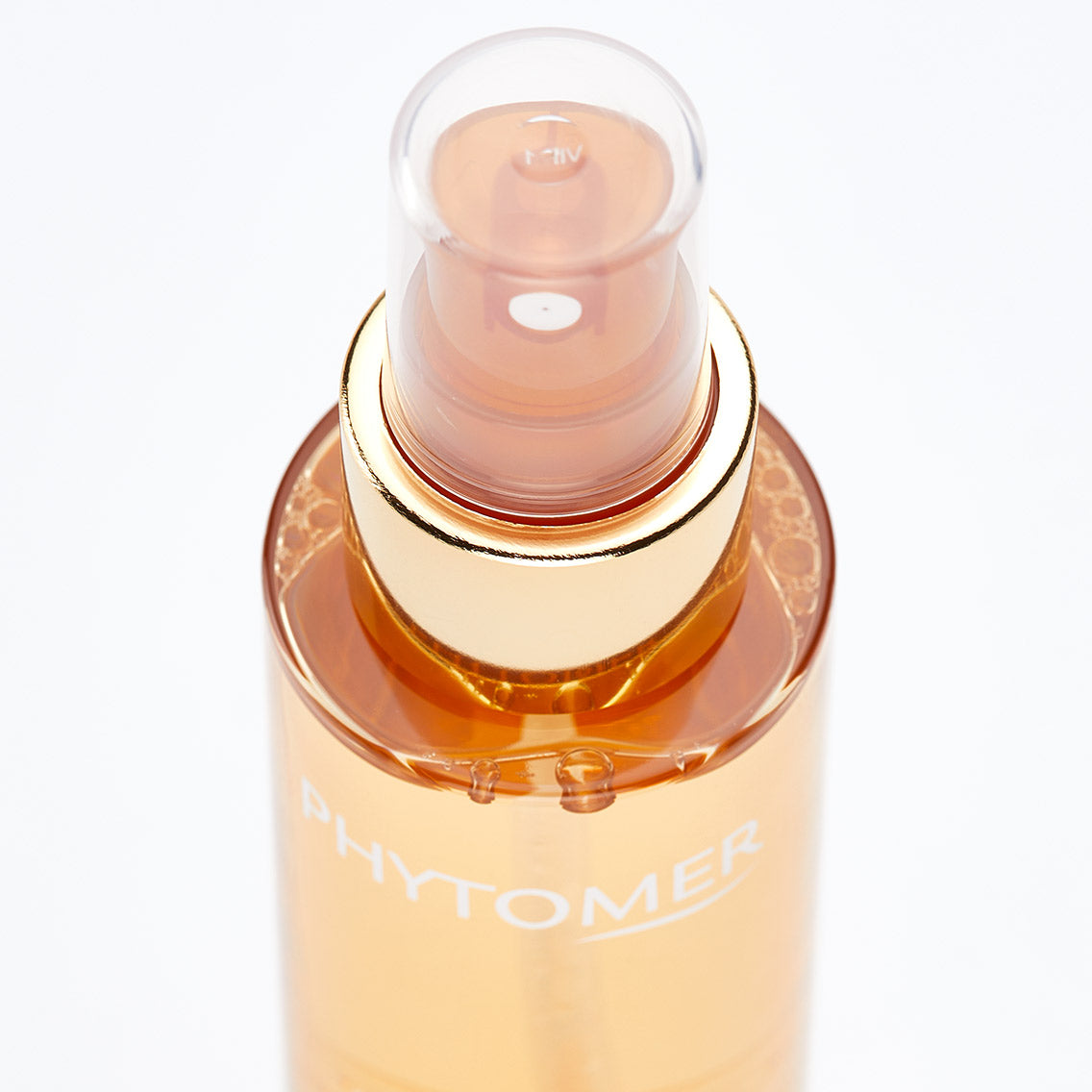 Skincare serum bottle with Phytomer branding on a white background