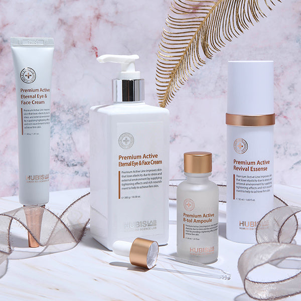 Set of skincare products with visible branding on a decorative background