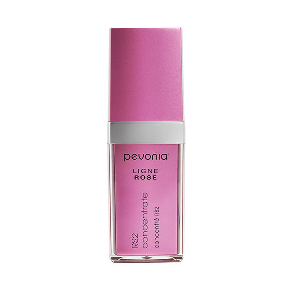 A bottle of Pevonia RS2 Rosacea Concentrate with a pink label and cap, designed for reducing redness and blotchiness on the skin.