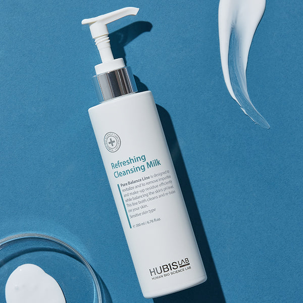 Hubislab Refreshing Cleansing Milk bottle on a blue background