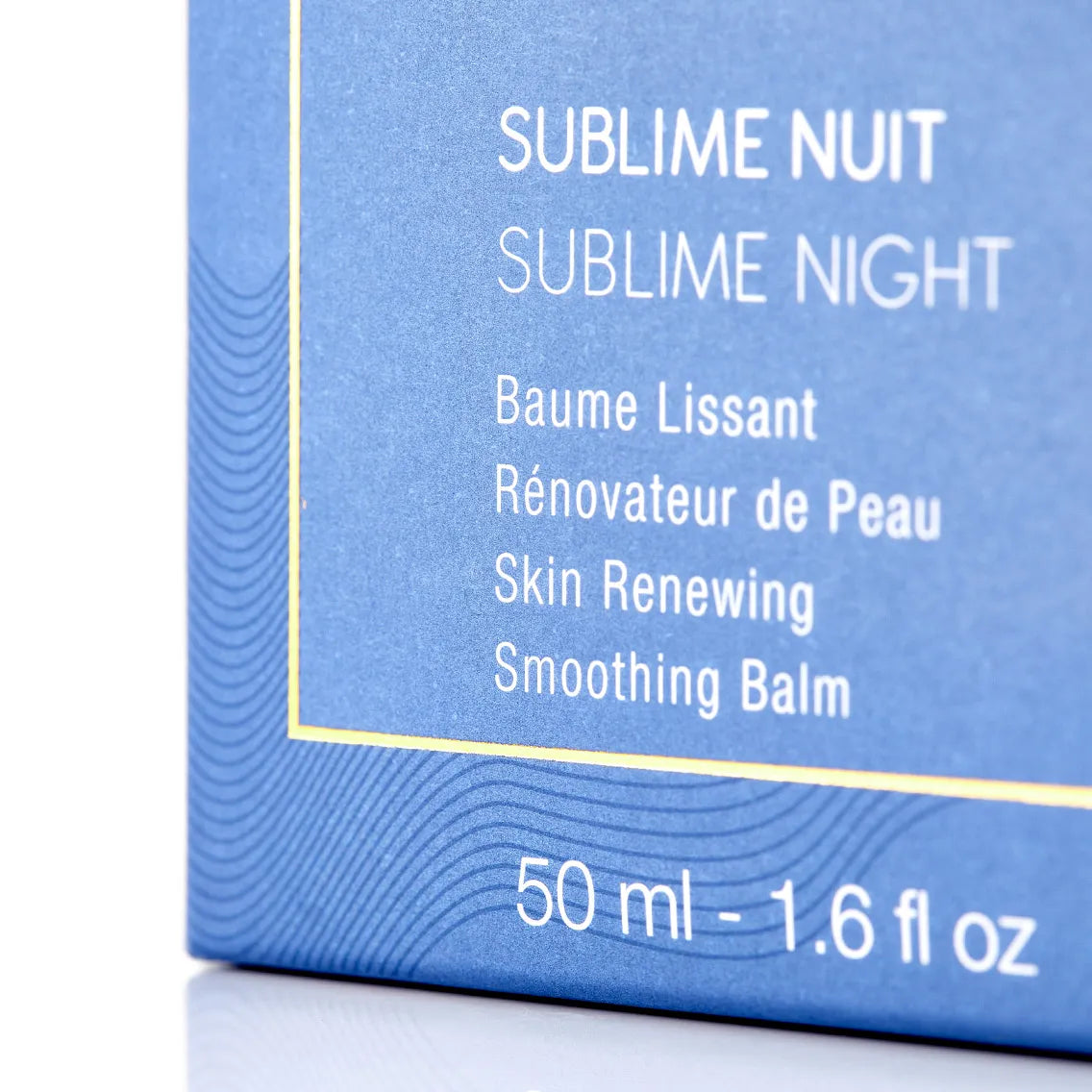 Blue packaging of 'Sublime Nuit' skin renewing smoothing balm with text on a white background