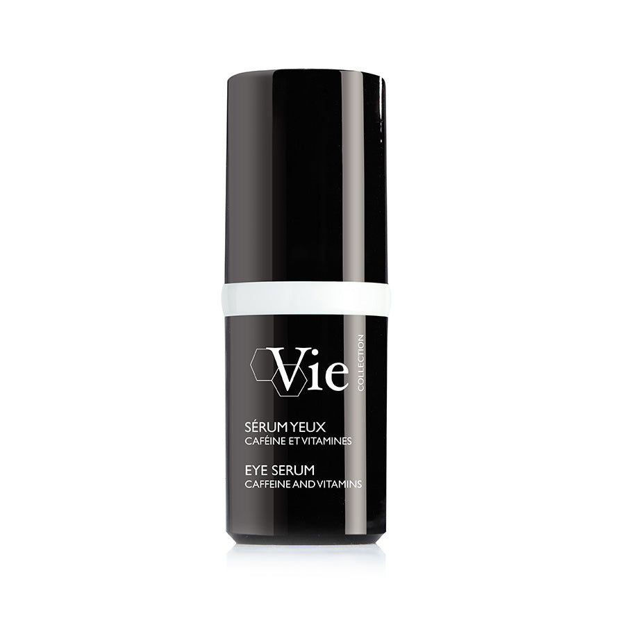 A black and white bottle of Vie brand eye serum with text indicating caffeine and vitamins as ingredients.