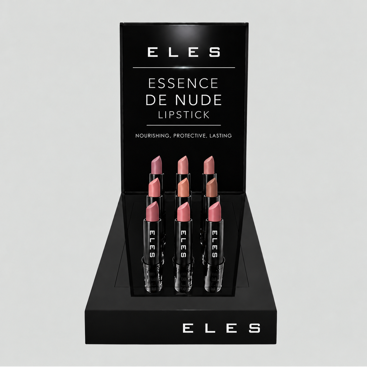 ELES Essence de Nude lipstick tester display stand with black branded backplate and nine uncapped nude lipstick shades.