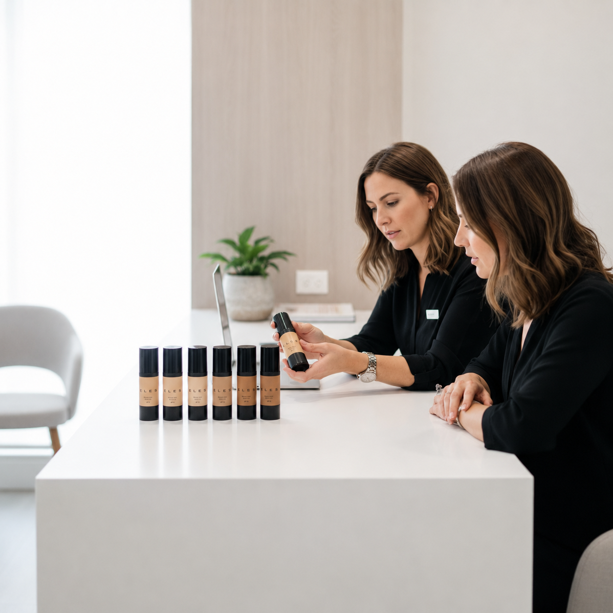 ELES Mineral Glow Skin Tint range displayed during a professional clinic consultation.
