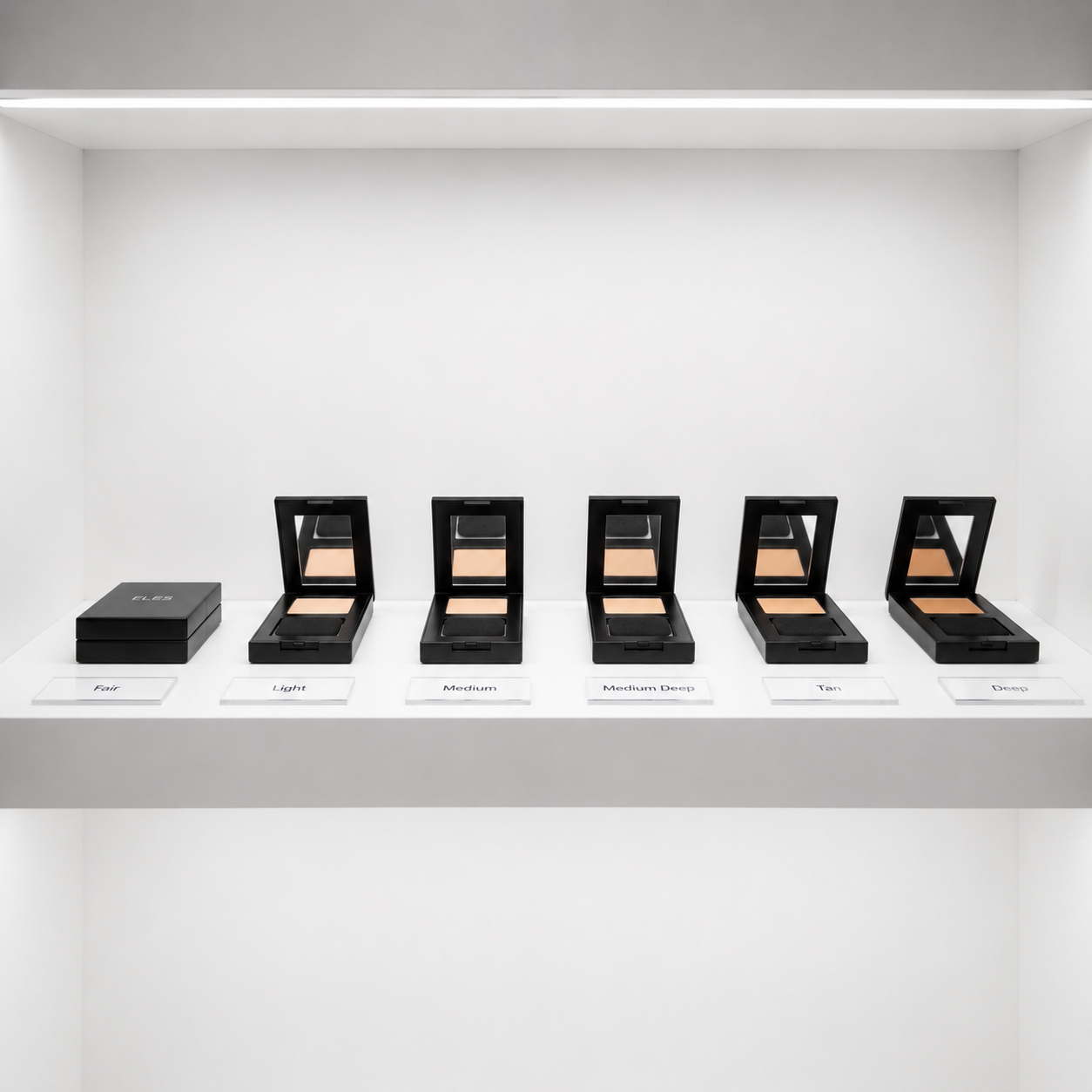 Row of  ELES Mineral SkinPerfect Powder Foundation SPF 15 on a white shelf