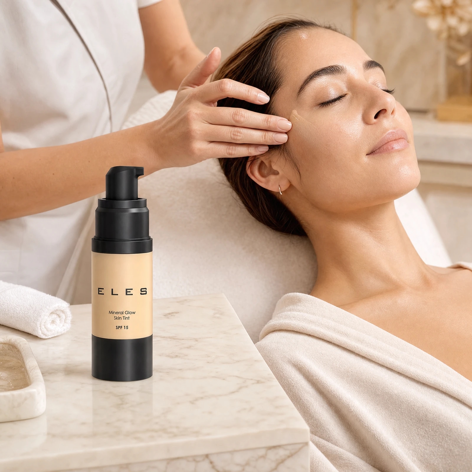 ELES Mineral Glow Skin Tint SPF 15 30ml applied by a professional therapist in a luxury clinic setting as a post-treatment glow-finishing step for radiant skin.