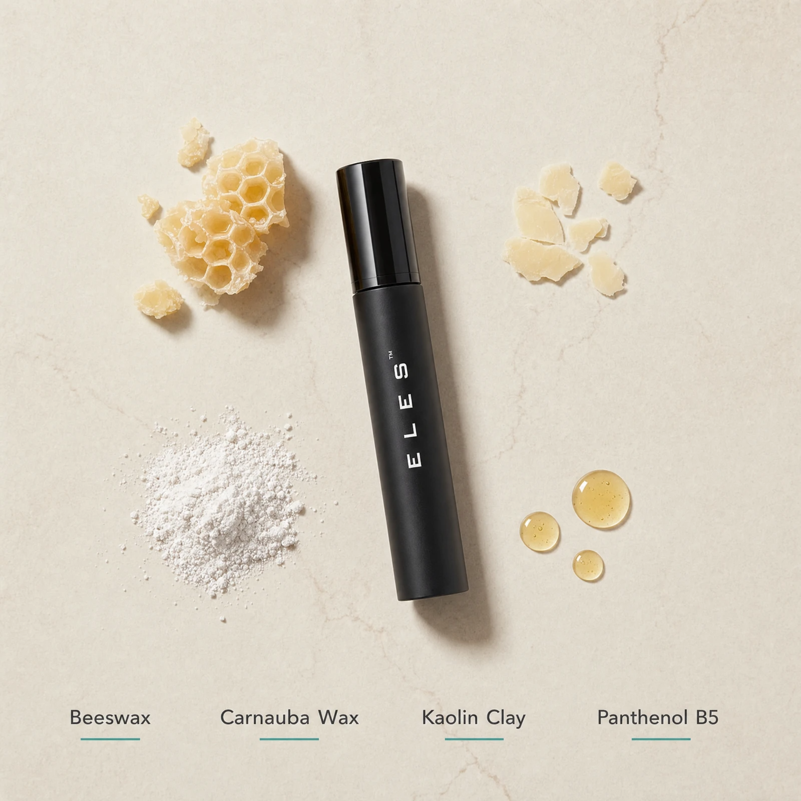 ELES Sensitive Eyes Mascara ingredient flatlay featuring beeswax, carnauba wax, kaolin clay and panthenol B5 on a warm limestone surface