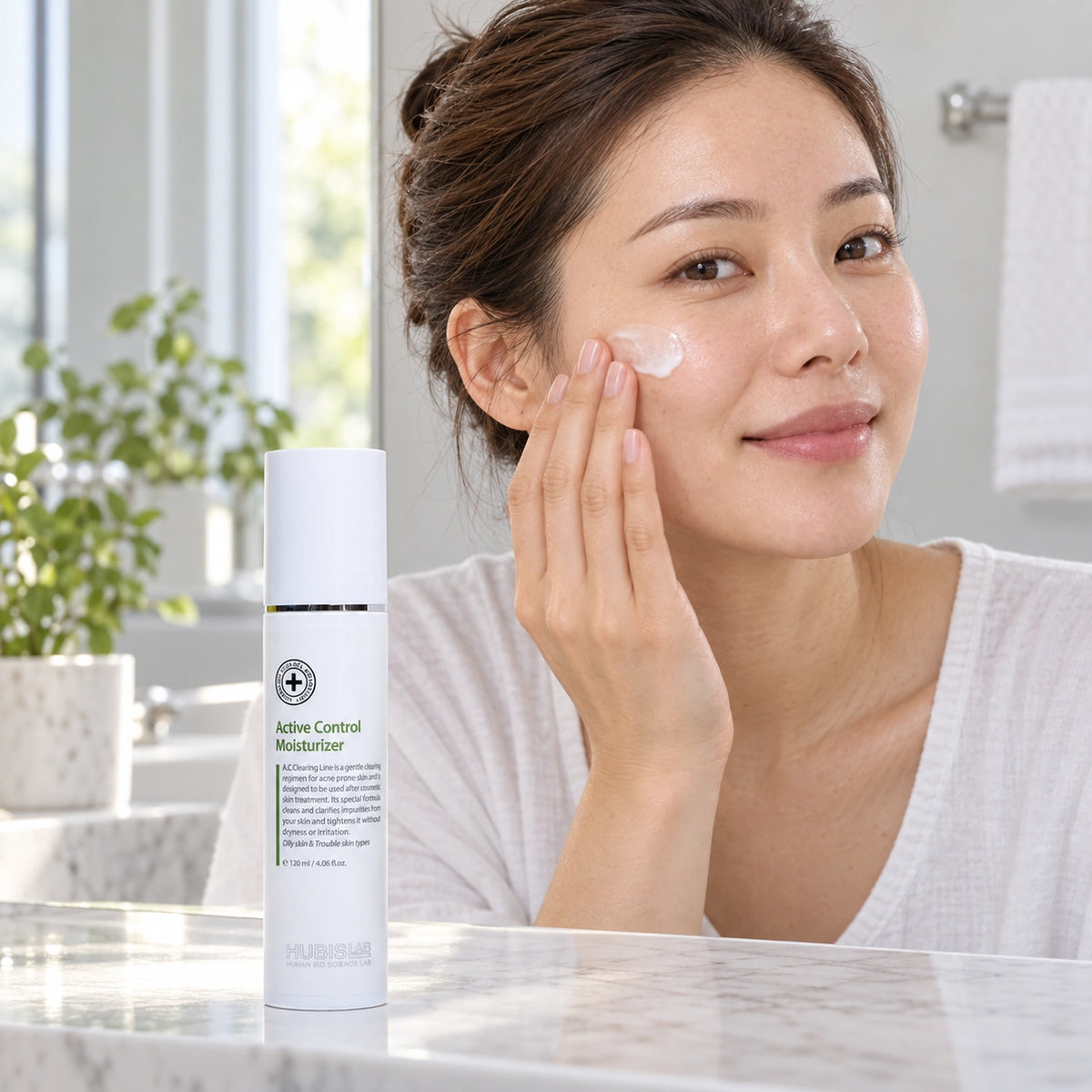 Woman applying moisturiser at home beside the retail Active Control Moisturiser 120 ml.