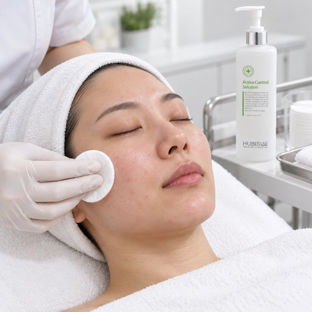 Therapist applying Active Control Solution with a cotton pad