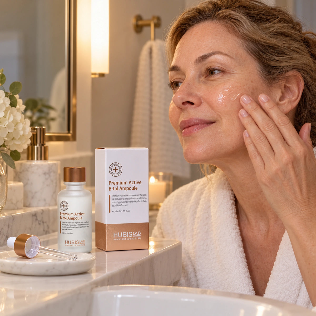 Client applying B-tol Ampoule during an evening homecare routine, with the 30 ml bottle and box.