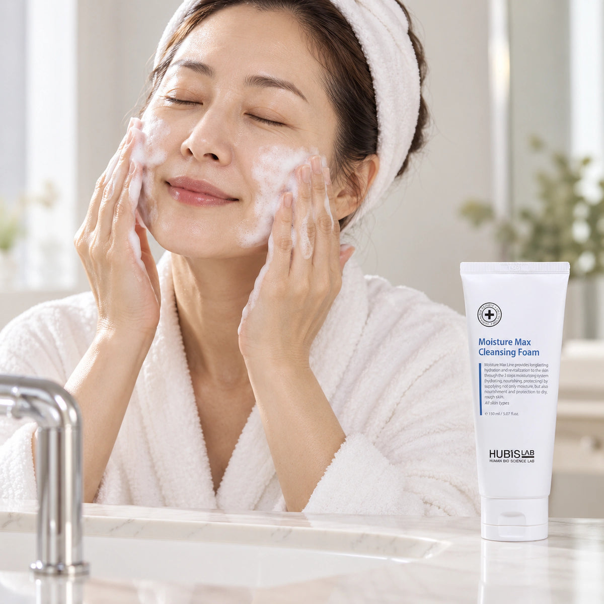 Client gently cleansing her face with foam beside HUBISLAB Moisture Max Cleansing Foam 150 ml.