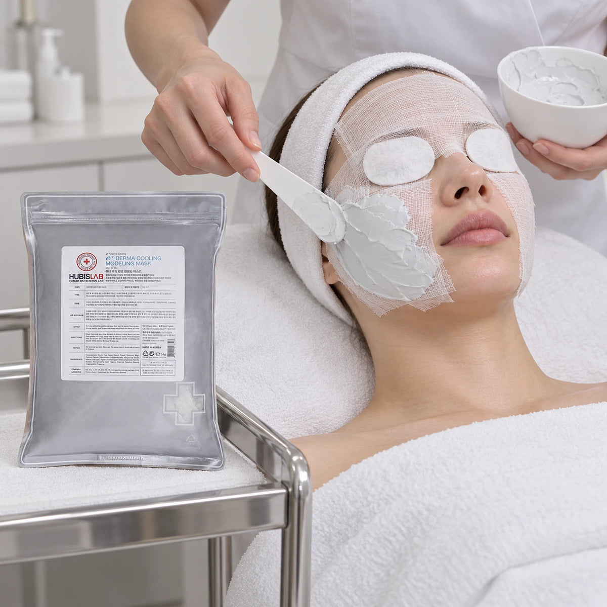 Professional cooling modelling mask application with eye protection and the nose and mouth clear.