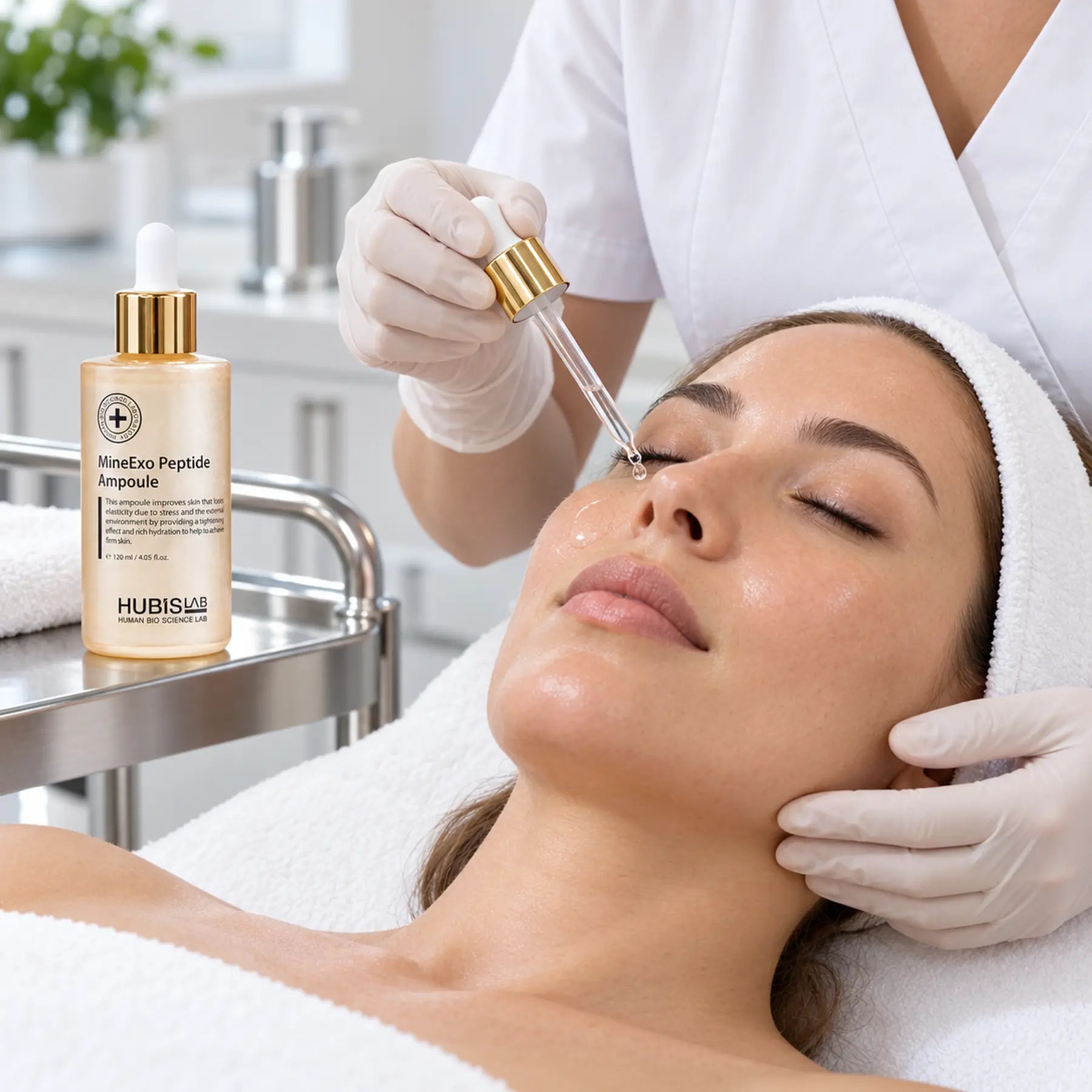 Therapist applying HUBISLAB Premium Active MineExo Peptide Ampoule during a professional facial treatment.