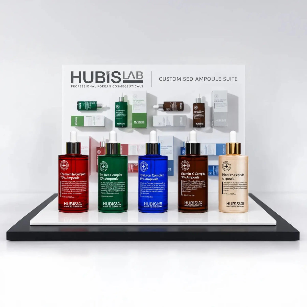 HUBISLAB Professional Ampoule Collection with five 120 ml ampoules on the complimentary branded countertop display stand.