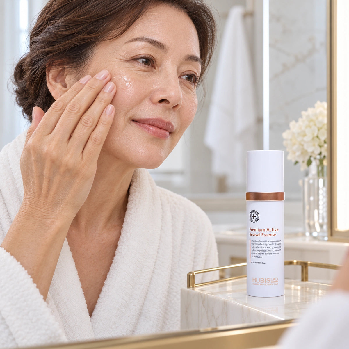 Client applying HUBISLAB revival essence with the 50 ml presentation shown.