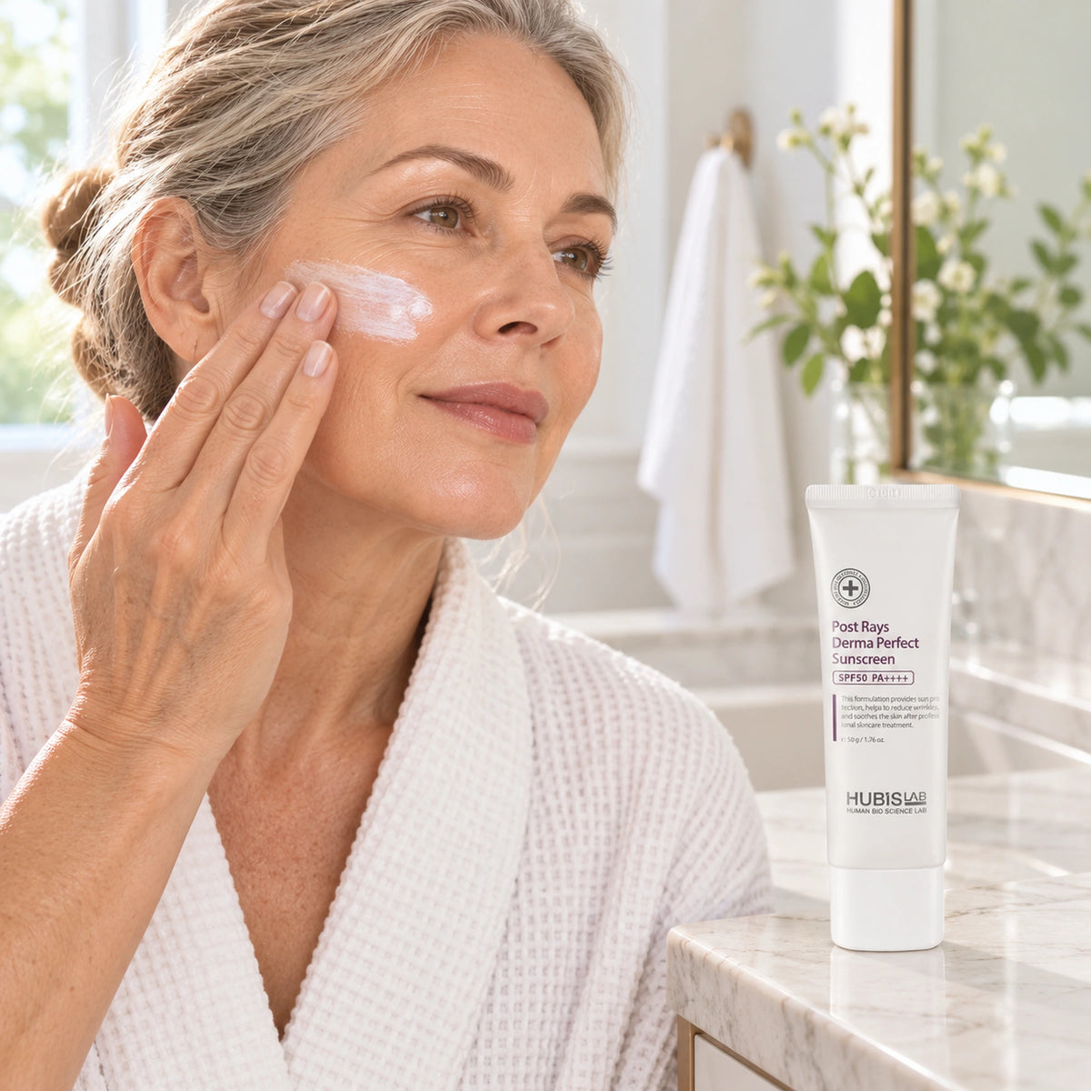 Client applying HUBISLAB sunscreen with the 50 g pack shown.