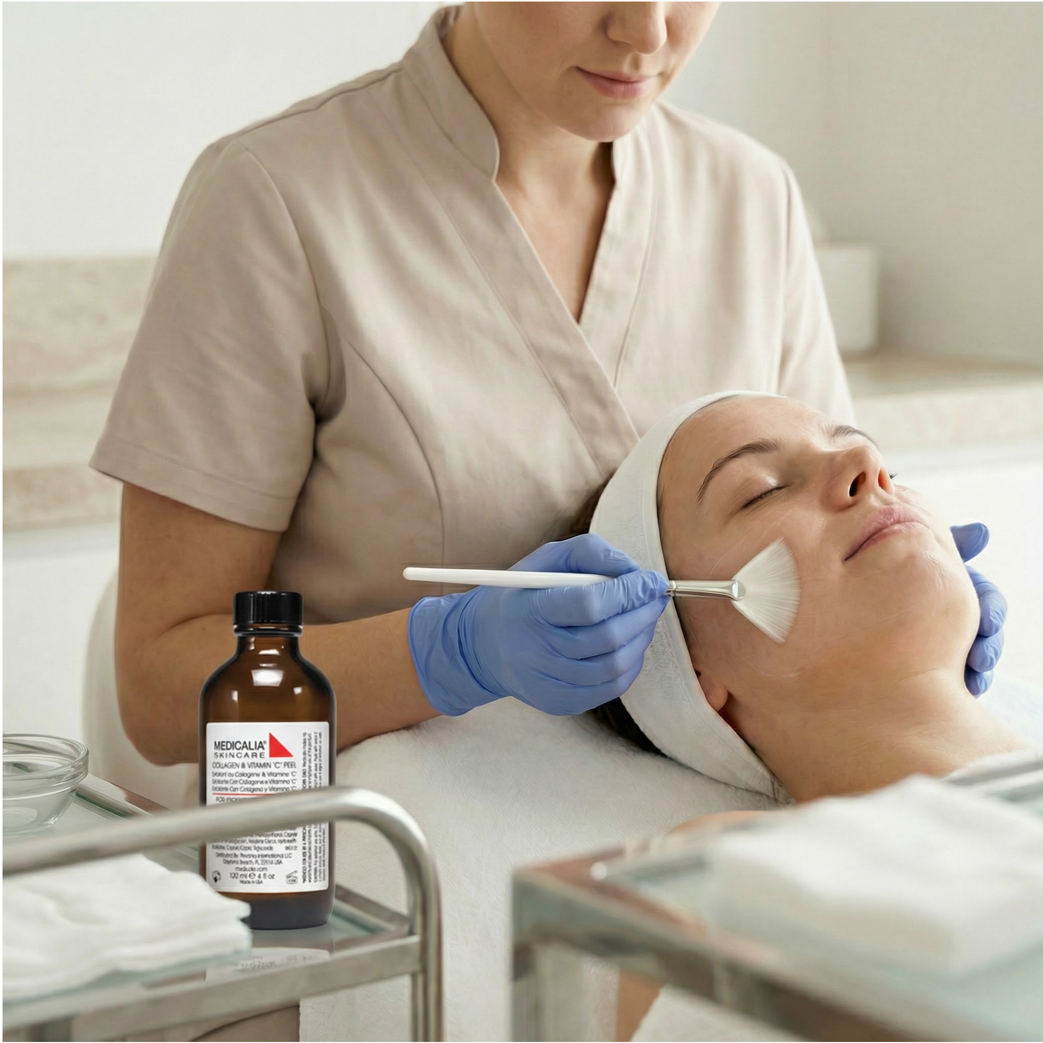 Medicalia Collagen and-Vitamin C Peel being applied with a brush from a glass bowl during a professional peeling treatment