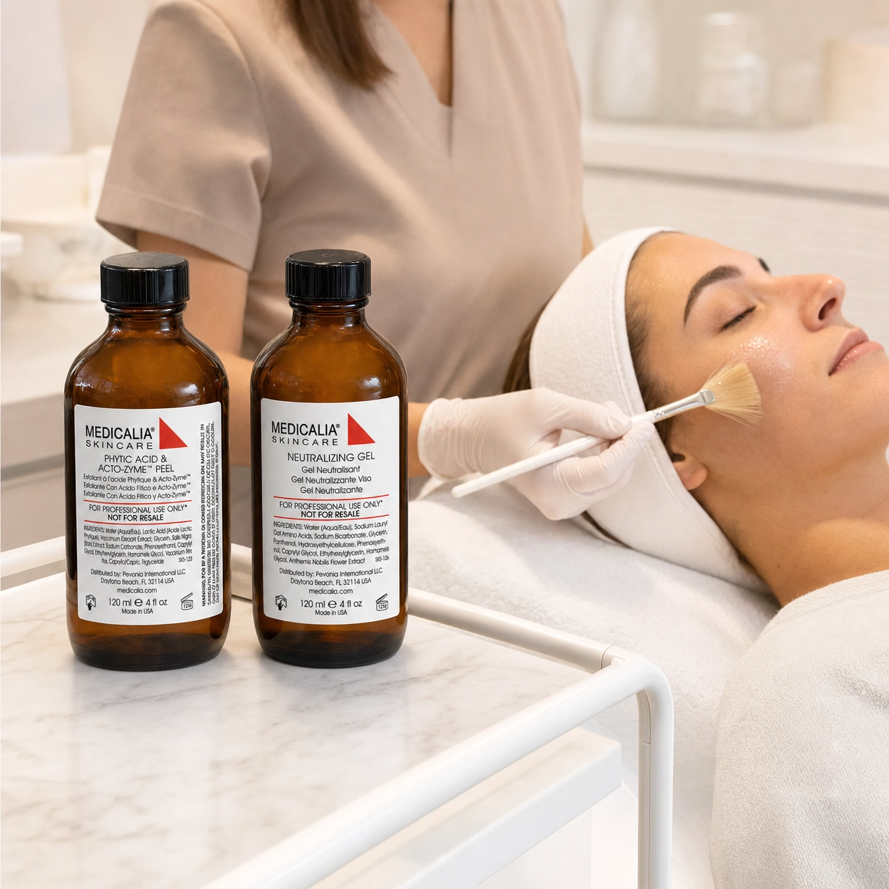Woman receiving a Medicalia peeling treatment with Medicalia skincare products on a counter.
