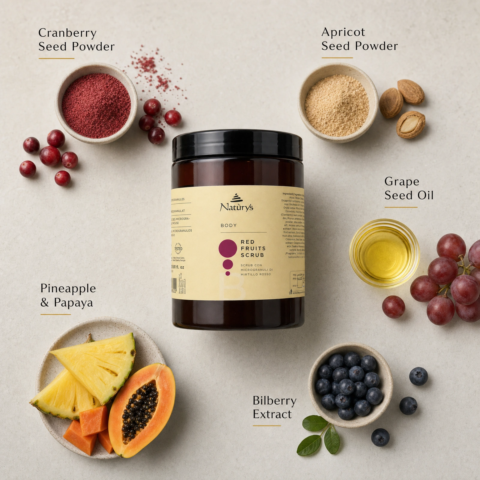 Naturys Body Red Fruits Scrub 1kg ingredient flatlay with Cranberry Seed Powder, Apricot Seed Powder, Grape Seed Oil, Pineapple and Papaya, and Bilberry Extract.