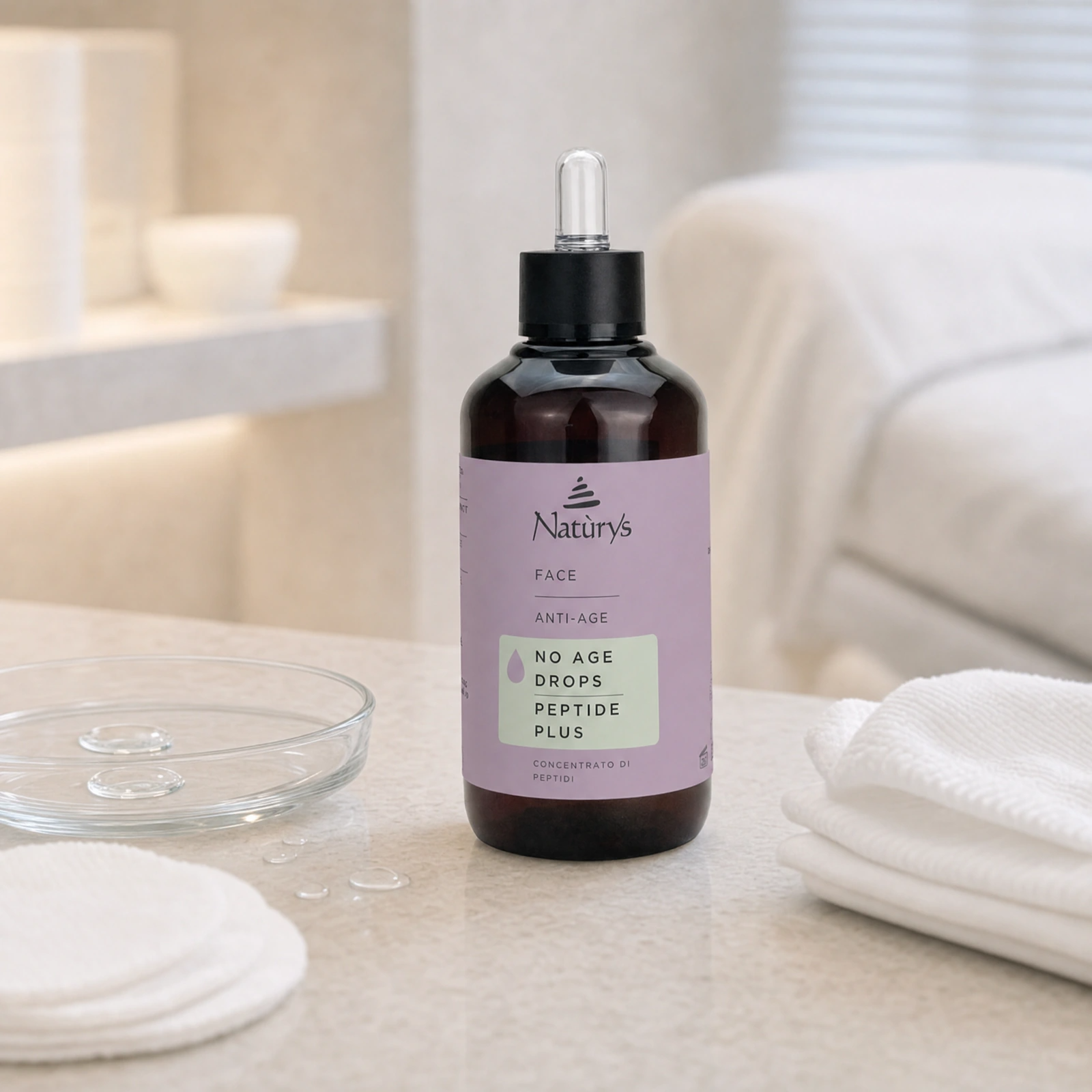 Naturys No Age Drops Peptide Plus 100ml displayed in a premium clinical treatment-room setting for professional firming, contouring and peptide anti-ageing protocols
