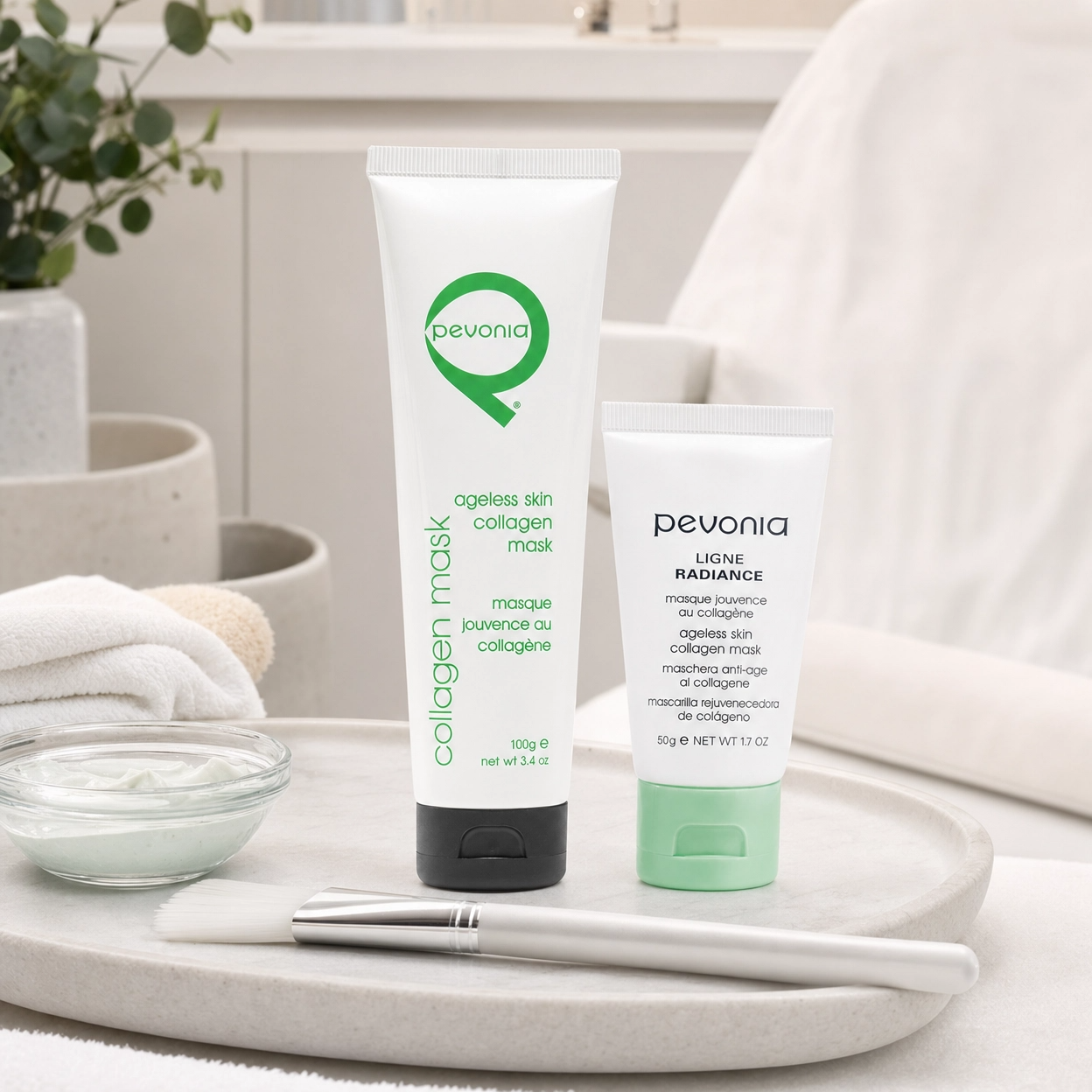 Pevonia Collagen Mask 100ml and 50g retail size displayed in a professional treatment room with mask texture and application brush.