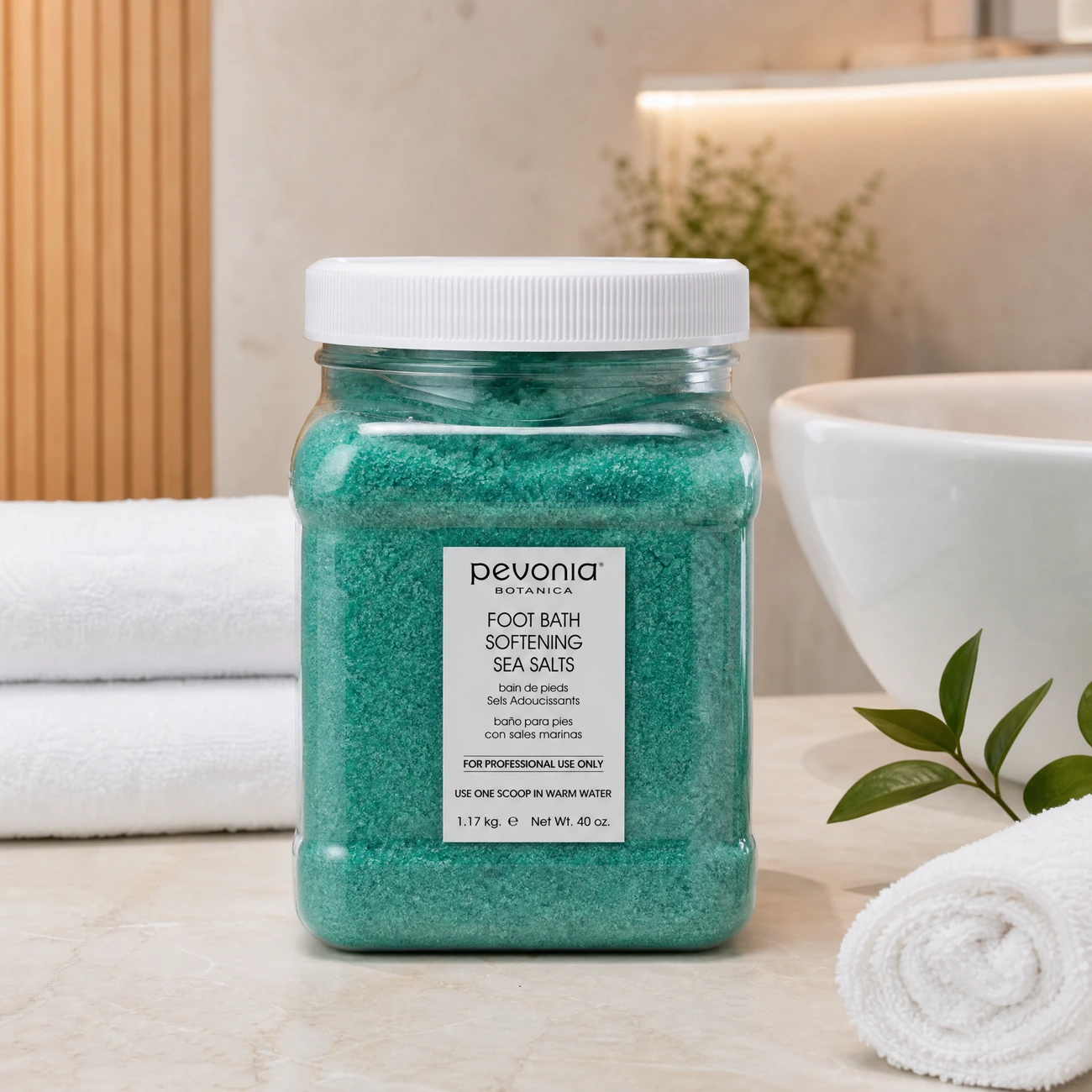 Pevonia Botanica Foot Bath Softening Sea Salts 1.17kg benefit callout image highlighting callus softening, antiseptic deodorising, mineral-rich sea salt, and foot fatigue relief.