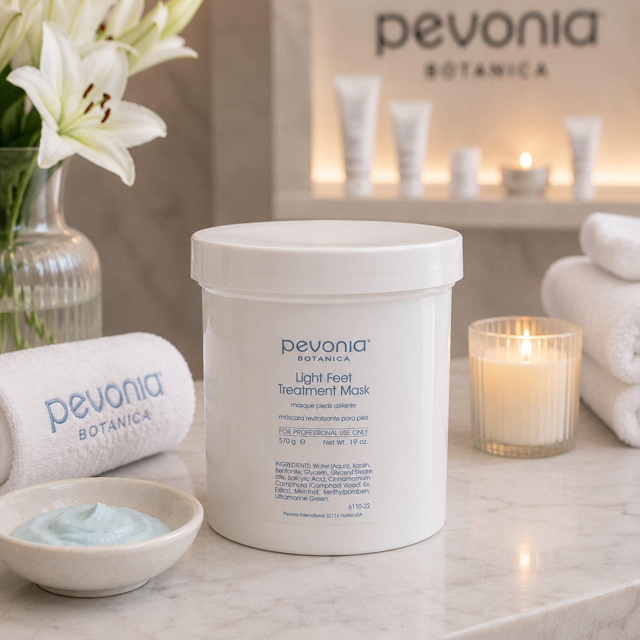 Pevonia Botanica Light Feet Treatment Mask 570g displayed in a luxury spa pedicure setting for softening professional foot treatments.
