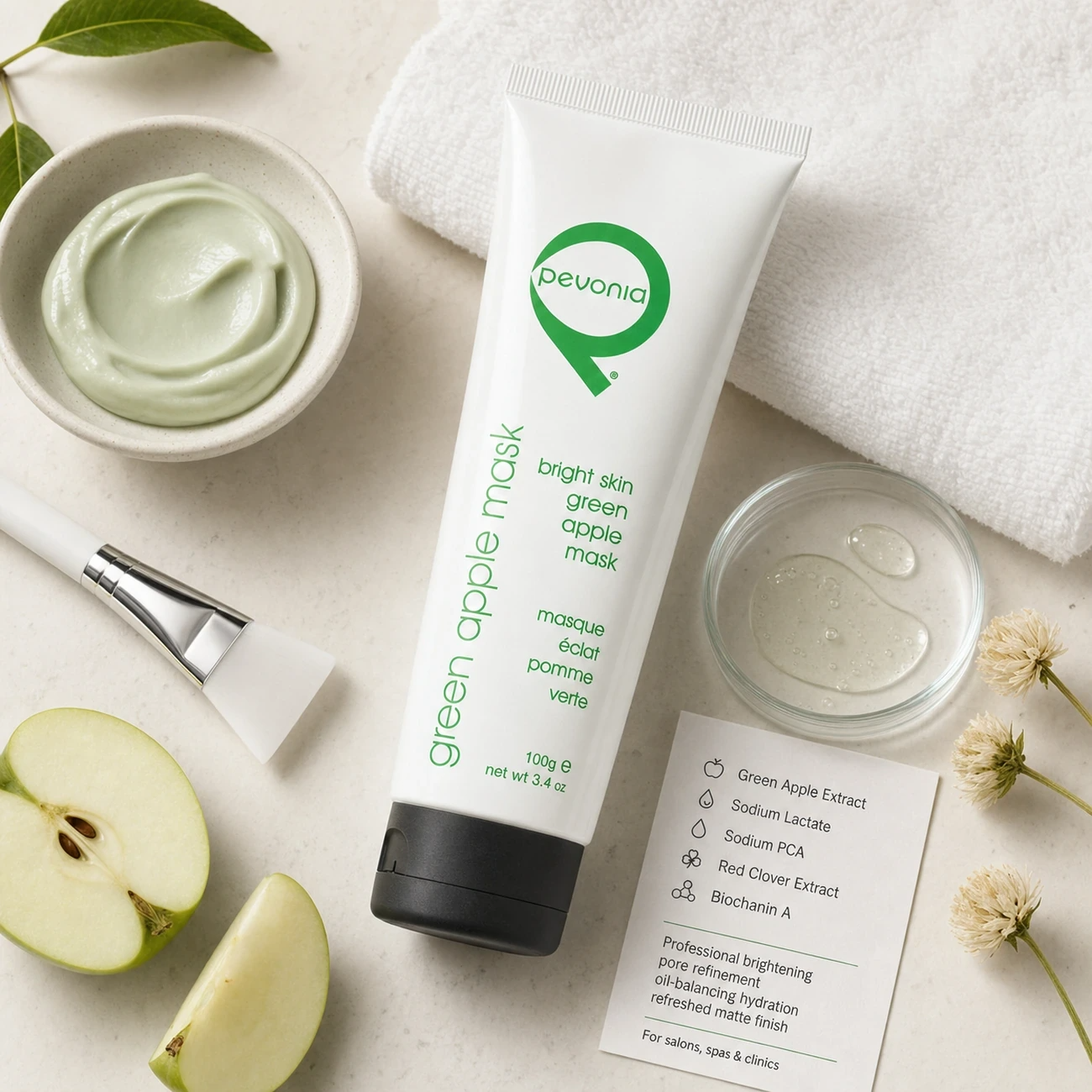 Pevonia Bright Skin Green Apple Mask 100g treatment-support flatlay with green apple, sodium lactate, sodium PCA, red clover and biochanin A references.