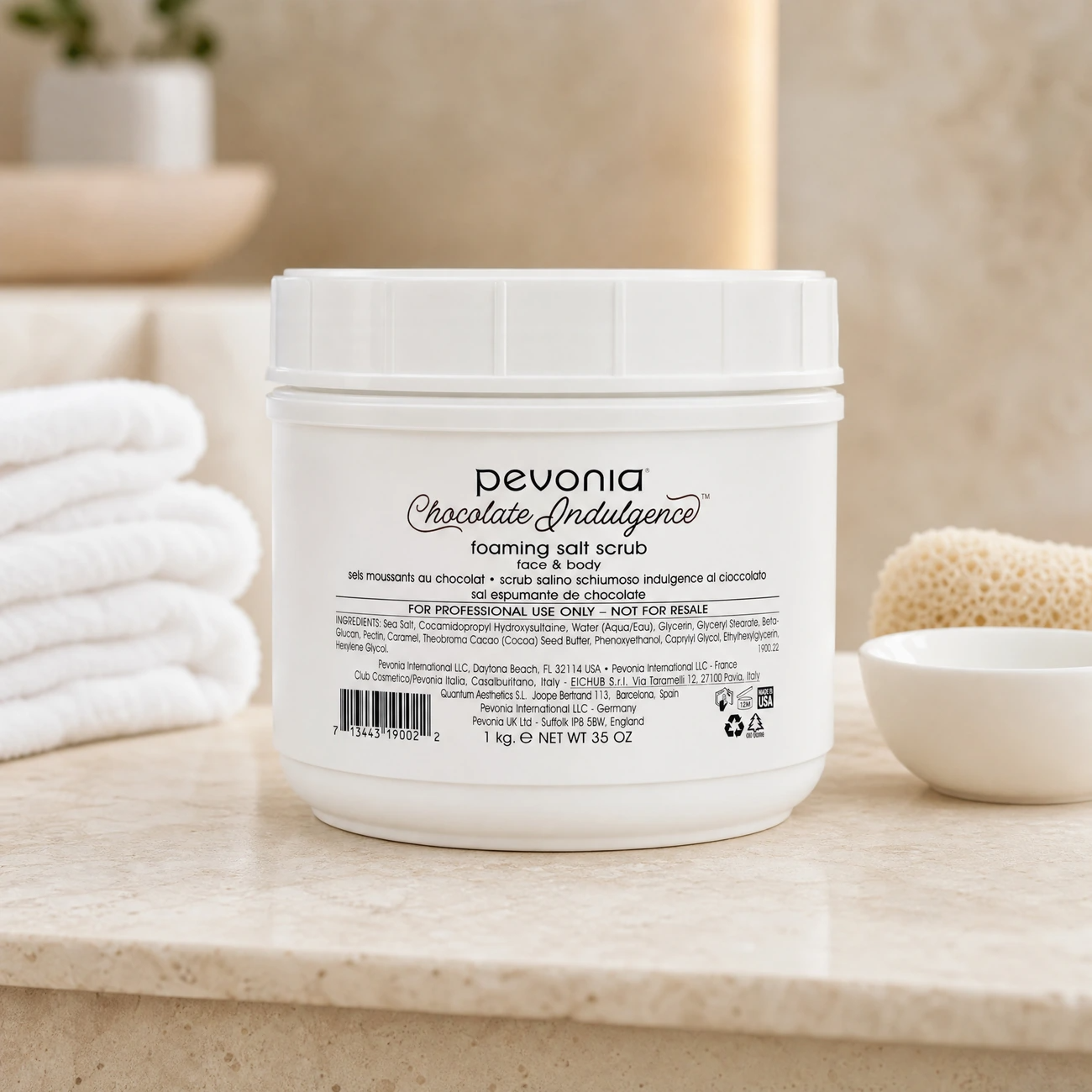Pevonia Chocolate Indulgence Foaming Salt Scrub Face & Body 1kg professional white tub styled in a serene clinical spa treatment room for Beauty Collective Pro.