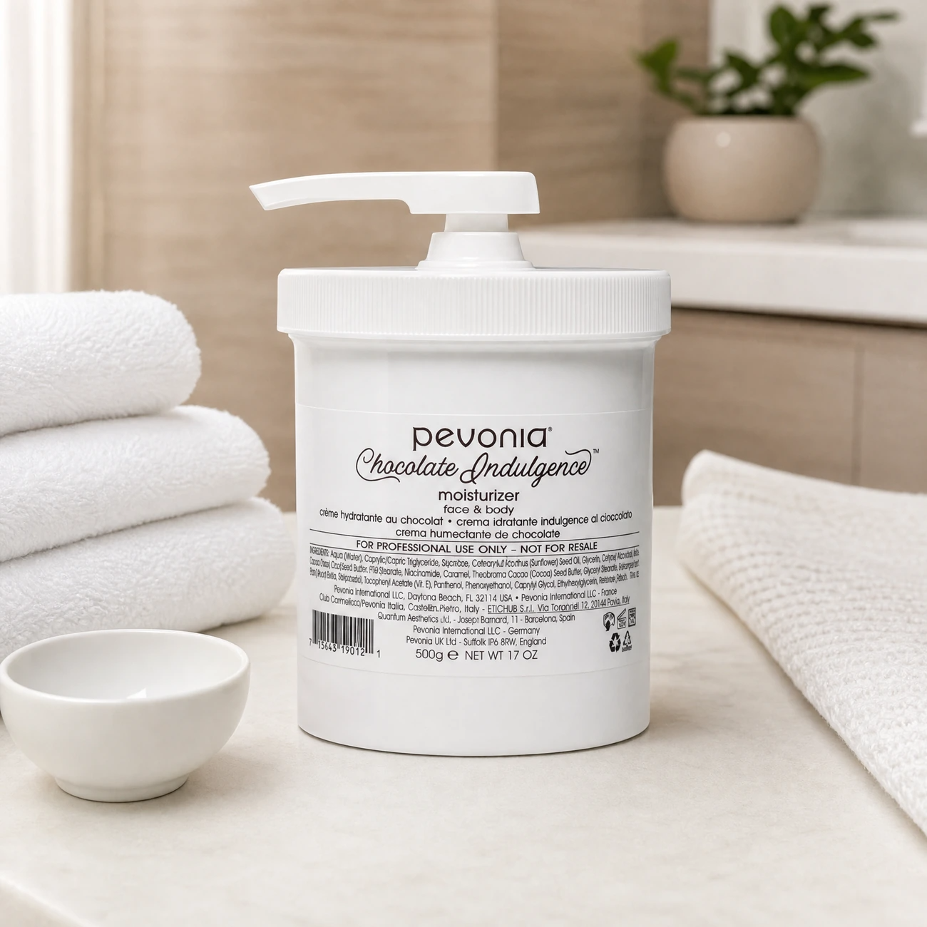 Pevonia Chocolate Indulgence Moisturizer Face & Body 500g professional white tub with pump styled in a serene clinical spa treatment room for Beauty Collective Pro.