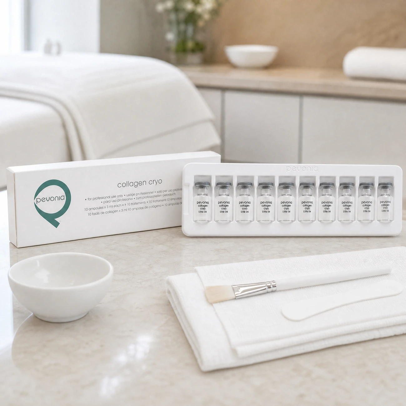 Pevonia Collagen Cryo 10-vial professional tray and white box styled in a serene clinical spa treatment room for Beauty Collective Pro.
