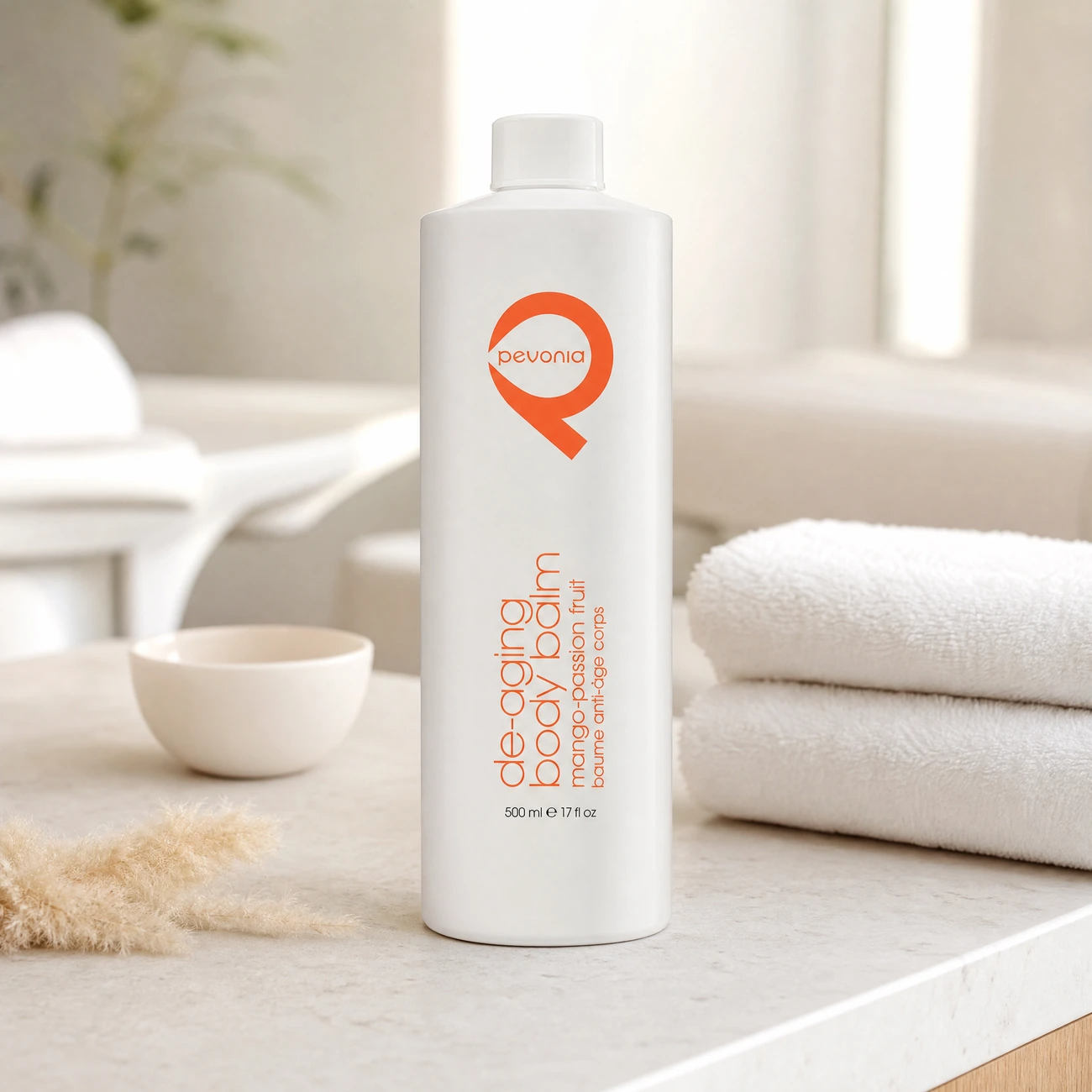 Pevonia De-Aging Body Balm Mango-Passionfruit 500ml professional tall white bottle styled in a serene clinical spa body treatment room for Beauty Collective Pro.