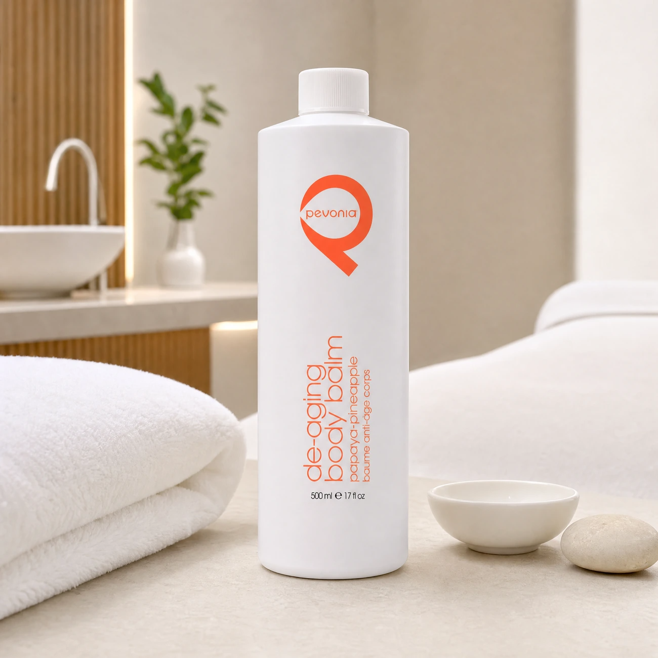 Pevonia De-Aging Body Balm Papaya-Pineapple 500ml professional tall white bottle styled in a serene clinical spa body treatment room for Beauty Collective Pro.
