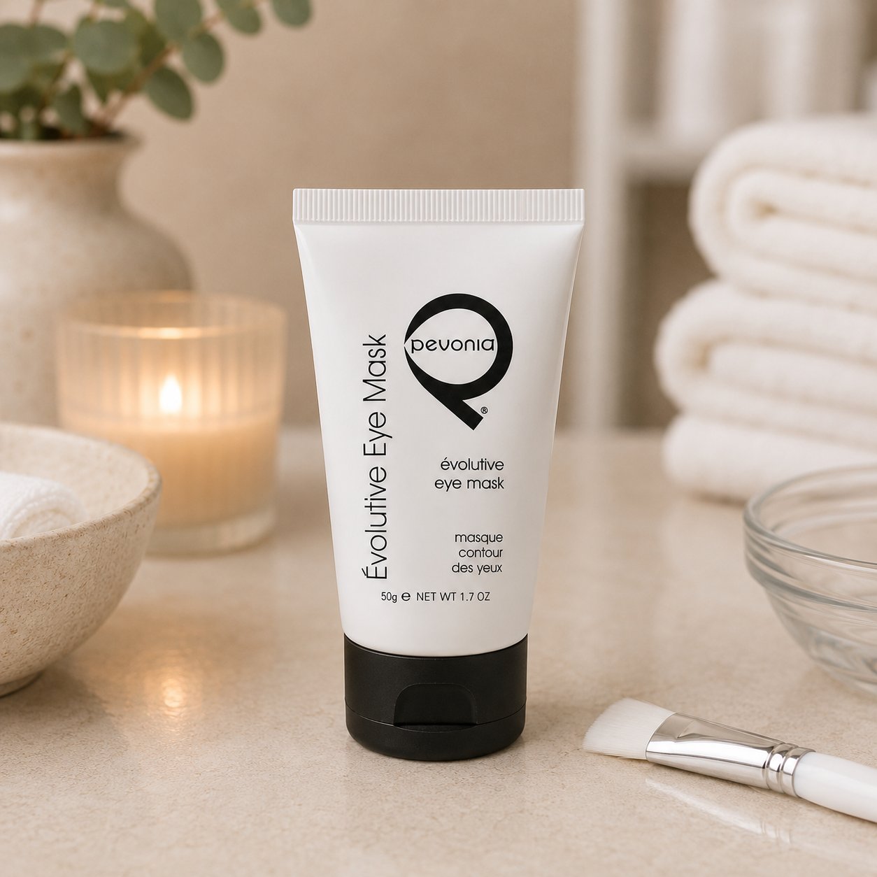 Pevonia Evolutive Eye Mask 50g tube displayed in a day spa facial treatment room with unbranded eye treatment accessories.